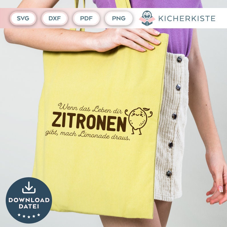 May include: A yellow tote bag with a brown graphic that says "Wenn das Leben dir Zitronen gibt, mach Limonade draus."  The graphic also includes a cartoon lemon with a smiling face and arms.