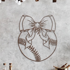May include: A brown baseball with a large bow tied around it. The baseball is outlined in a dark brown color and the bow is made of a thin, brown line.