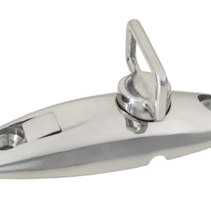 May include: A silver-toned stainless steel boat cleat with a loop on top. The cleat has a smooth, polished finish and is designed for securing ropes or lines.
