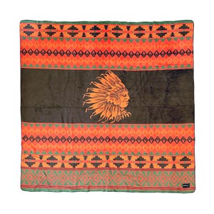 May include: A brown and orange fleece blanket with a Native American headdress design. The blanket has a geometric pattern of orange, green, and black.