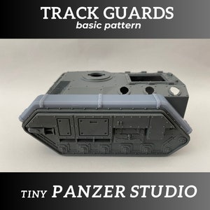 May include: A gray plastic model tank track guard with a basic pattern. The track guard is designed to be added to a model tank. The text "TRACK GUARDS basic pattern" is printed on the top of the image. The text "TINY PANZER STUDIO" is printed on the bottom of the image.