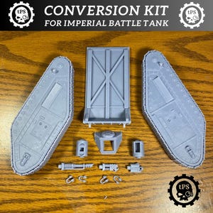 May include: A gray conversion kit for an Imperial Battle Tank, featuring various components like tracks, a door, and smaller parts. The kit includes the text "CONVERSION KIT FOR IMPERIAL BATTLE TANK". The kit is designed for model enthusiasts.