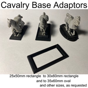 May include: Three black plastic bases for miniature figures, designed to adapt from a 25x50mm rectangle to a 30x60mm rectangle, a 35x60mm oval, and other sizes. The bases are shown with miniature cavalry figures.