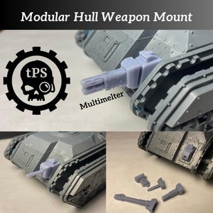 May include: A modular hull weapon mount with the text "Modular Hull Weapon Mount" and "Multimelter". The image shows a grey tank with a grey weapon attached. The logo for tPS is also visible.