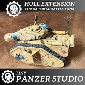 May include: A tan-colored miniature Imperial Battle Tank hull extension. The model features black treads, blue and red accents, and the text "HULL EXTENSION FOR IMPERIAL BATTLE TANK" and "TINY PANZER STUDIO".
