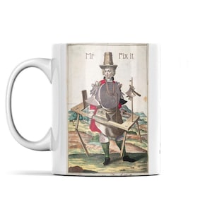 May include: White ceramic mug featuring a vintage illustration of a man with tools, labeled "Mr Fix it". The artwork depicts a figure in a red coat and hat, surrounded by woodworking tools, on a light beige background.