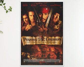 May include: A framed movie poster for "Pirates of the Caribbean: The Curse of the Black Pearl." The poster features actors Johnny Depp, Orlando Bloom, and Keira Knightley. The title is displayed on a scroll.