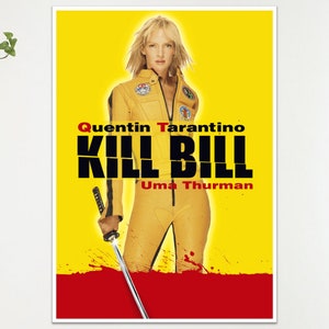 May include: A framed poster for the film "Kill Bill" starring Uma Thurman. The poster has a yellow backdrop with the film's title in bold black letters and the director's name, Quentin Tarantino, in red. The actress is in a yellow jumpsuit, holding a sword.