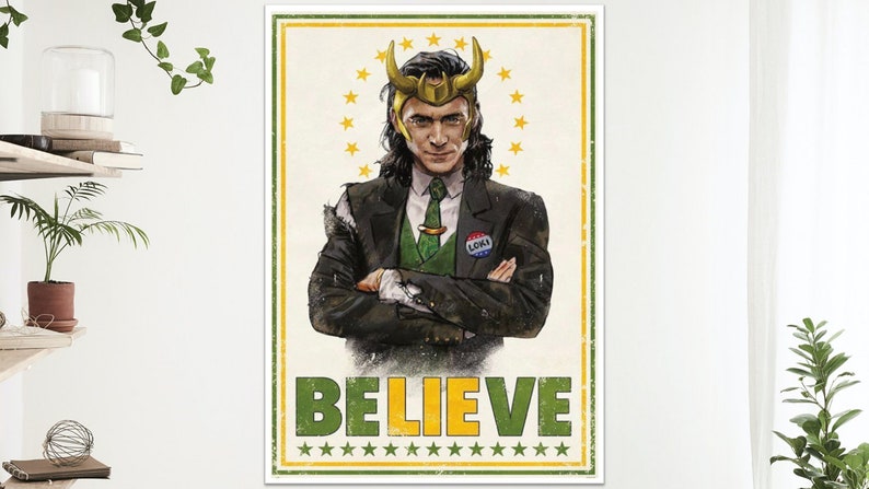 May include: Poster featuring a stylized illustration of Loki in a suit, wearing a golden horned helmet. The poster has a vintage design with the word "BELIEVE" in green and yellow, and a "Loki" button.