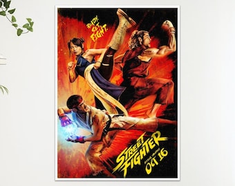 May include: A rectangular Street Fighter movie poster featuring three characters in dynamic combat poses against a vibrant red and orange background. The text READY SET FIGHT appears at the top, with STREET FIGHTER OCT 16 at the bottom.