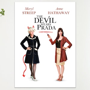 May include: Poster for the film "The Devil Wears Prada" featuring Meryl Streep and Anne Hathaway. The title is in bold red letters. Meryl Streep is dressed in a black coat with white trim and devil horns. Anne Hathaway is in a red coat.
