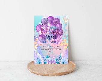 Può includere: Invito a una festa di compleanno a tema sirene con colori viola e blu, un'illustrazione di sirena, palloncini e il testo "JOIN US FOR A MERMAID PARTY belamila 2nd Birthday APRIL 08 | SUNDAY | 3PM 123 ANYWHERE ST.. ANY CITY RSVP:"