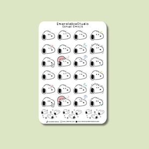May include: A sticker sheet featuring various Snoopy emojis in black and white. The emojis depict different expressions, including sleeping, happy, and surprised. The sheet also includes the text "EmeraldAceStudio Esnupi Emojis".