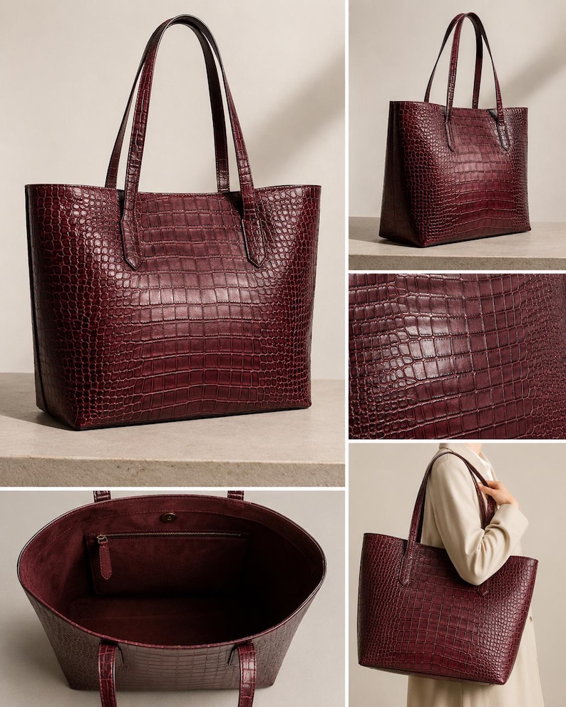 May include: A deep burgundy tote bag featuring a textured crocodile-embossed pattern. The bag has two shoulder straps, a spacious open interior with a single zippered pocket, and a magnetic snap closure at the top center of the main compartment.