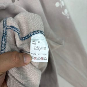 May include: A rustic wooden sign with the text "Welcome to our home" in white lettering. The sign features a distressed finish and a simple, inviting design, perfect for front door decor.