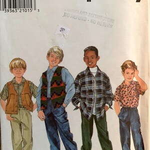 May include: A Simplicity sewing pattern for boys' clothing, featuring four boys wearing different outfits. The pattern number is 7892 and the sizes are AA 3, 4, 5, 6. The pattern includes a waistcoat, a plaid shirt, a patterned shirt, and a plain shirt.