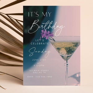 May include: A birthday party invitation with a blue and pink gradient background. The invitation features a martini glass with a flower garnish and the text "It's My Birthday", "Let's Celebrate", "Sunday", "June 21st", "At 4:00PM", "123 Main Street", "Dallas TX", and "RSVP: 123-456-7890".
