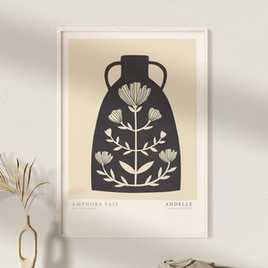 Könnte beinhalten: Eine Schwarzweißillustration einer Vase mit Blumen. Die Vase ist amphorenförmig und hat ein schlichtes, minimalistisches Design. Der Text "AMPHORA VASE" und "ANDELLÉ" ist unter der Vase gedruckt.