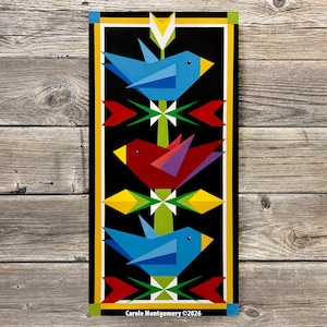May include: A rectangular wall art piece featuring a vertical green stem with three stylized birds. The top and bottom birds are blue with yellow beaks, and the middle bird is red with purple wings. Geometric red and yellow shapes accent the stem.