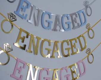 Engagement banner bunting with rings we're engaged banner gold pink rose gold black