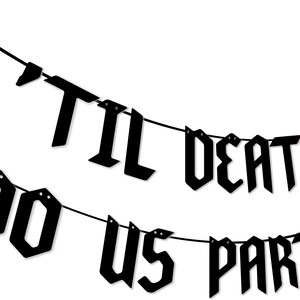 May include: Black and white banner with the text "'Til Death Do Us Party" in gothic font. The banner is strung with black string and has a coffin shape at each end.
