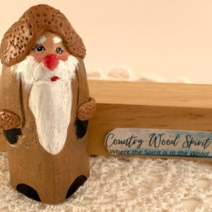 Carved Santa-like keepsake figure.  Perfect for year-round display.  Great gift idea for anyone on your gift list.  Christmas is coming!