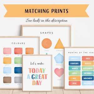 May include: Set of six printable posters for kids featuring watercolor illustrations of colors, shapes, and months of the year. The posters have a light wood frame and a white background. The text on the posters includes "Let's make today a great day", "Colors", "Shapes", and "Months of the Year".