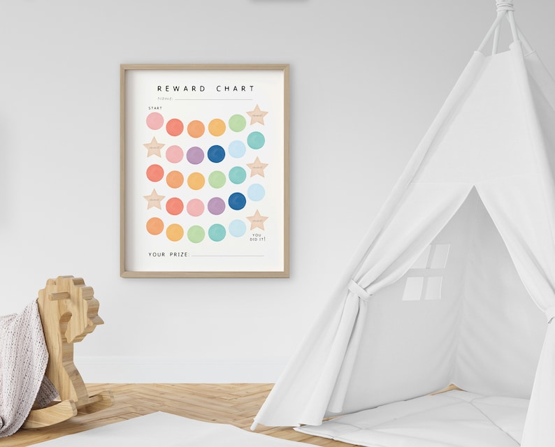 May include: A printable reward chart with a colorful design. The chart features a grid of circles in various colors, including pink, orange, yellow, green, blue, and purple. The chart also includes a section for a "prize" and the text "You did it!" at the bottom.