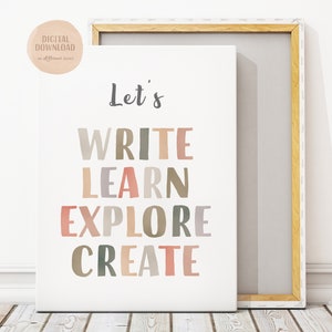 May include: A framed canvas print featuring the words "Let's WRITE LEARN EXPLORE CREATE" in a variety of muted colours. The print has a white background and is framed in light wood. A circular sticker in the upper left corner says "DIGITAL DOWNLOAD in different sizes."