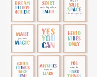 May include: Nine colorful framed prints with motivational quotes. The quotes are: "Dream Believe Achieve", "Start each day with a Smile", "This is a Safe Space to be who you are", "Make your own Magic", "Yes You Can", "Good Vibes Only", "Good Things Take Time", "Mistakes make me Learn", "You can do Hard Things".