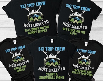 May include: Five black t-shirts with a ski trip crew theme. Each shirt features a graphic of a ski mask with a mountain scene and text that says "Ski Trip Crew" and "Most Likely To" followed by a humorous ski-related activity.
