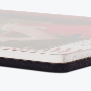 May include: A rectangular coaster with a white border featuring a red baseball stitch pattern. The top surface displays a glossy, colorful graphic print, while the base is constructed from a thick, dark, non-slip material with rounded corners.