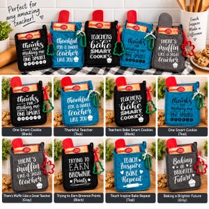 May include: A collection of fabric oven mitts in black, teal, and gray, each featuring white text and a small Betty Crocker cookie mix packet. The mitts include phrases like 'Teachers bake smart cookies' and 'There's muffin like a great teacher'.