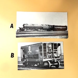 May include: Two black and white photographs of vintage trains. The top image shows a large steam locomotive on tracks. The bottom image features a freight car with the number 27502 on its side.