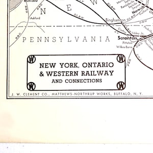 May include: A vintage map of the New York, Ontario & Western Railway and connections. The map features the states of Pennsylvania and New York, with railway lines and city names. The text "NEW YORK, ONTARIO & WESTERN RAILWAY AND CONNECTIONS" is prominently displayed.