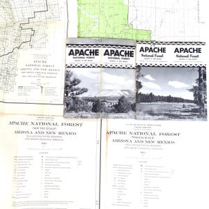 May include: A collection of vintage maps and brochures for the Apache National Forest in Arizona and New Mexico. The brochures feature black and white landscape photos. The maps include legends and details of the area.