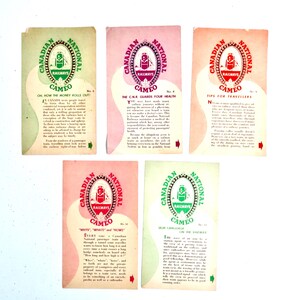 May include: A collection of vintage Canadian National Railways "Cameo" cards. Each card features the company logo and text, with varying color schemes of green, red, and pink. The cards are rectangular and appear aged.