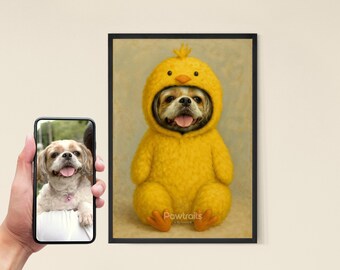May include: A framed portrait of a dog wearing a yellow chick costume. The dog's face is visible through the hood, with its tongue sticking out. The portrait is displayed next to a phone showing a photo of the dog.