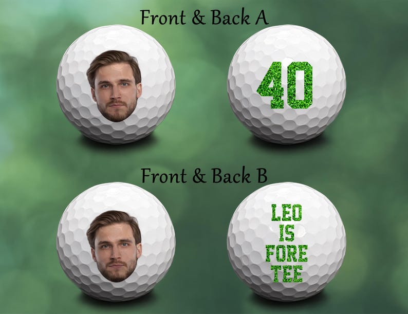 May include: Two white golf balls with green designs. One ball has the number 40 in green glitter. The other ball has the text "LEO IS FORE TEE" in green glitter.