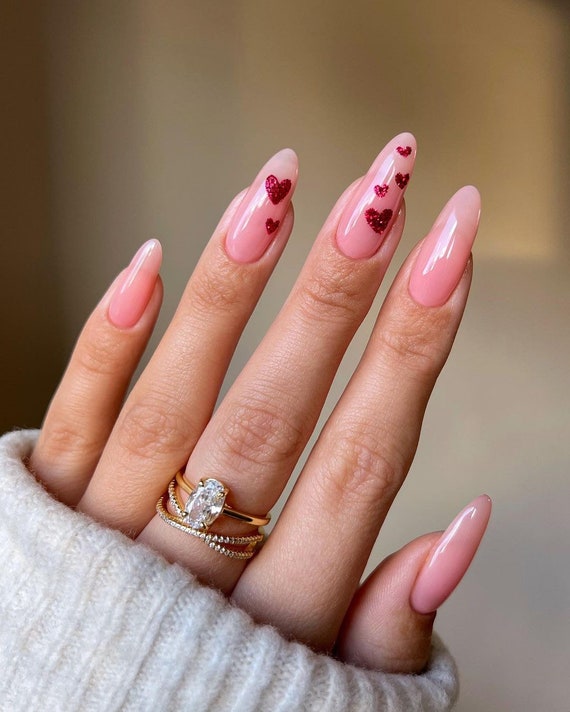 Pink nails with glitter ring finger discount