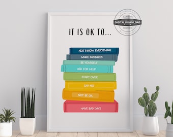 Peut inclure: Une impression encadrée blanche avec le texte "It is OK to..." et une pile de livres colorés avec des phrases comme "Ne pas tout savoir" et "Avoir de mauvaises journées".