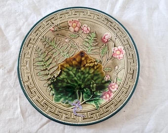 Majolica or Barbotine Choisy Le Roi plate with leaves and pink flowers from the 19th century