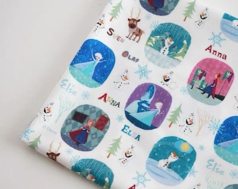 May include: White fabric featuring a repeating pattern of characters from the movie Frozen. The design includes Elsa, Anna, Olaf, and Sven, set within oval frames, along with snowflakes and trees. The names of the characters are also printed on the fabric.
