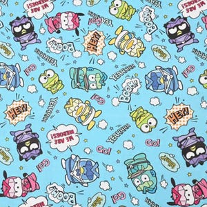 May include: A light blue fabric featuring cartoon characters in various colors, including purple, pink, yellow, and green. Speech bubbles with phrases like "HEY!", "BOOM!", and "WE ARE HEROES!" are scattered across the design.