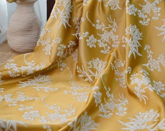 Tela brocada de diseño jacquard con estampado floral en amarillo brillante por metro
