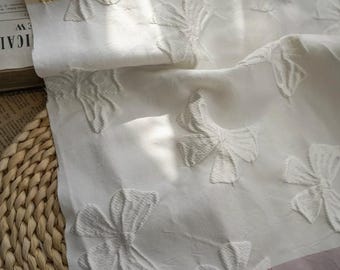Tela de brocado con diseño de jacquard con lazo blanco y relieve por metro