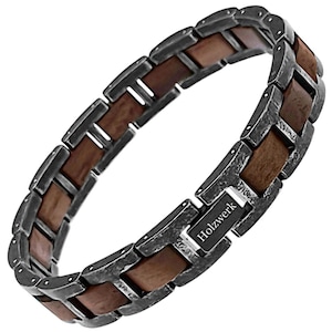 Pode incluir: Uma pulseira de metal escuro com incrustações retangulares de madeira. A pulseira apresenta um fecho com a palavra "Holzwerk" gravada. A pulseira é um acessório elegante.