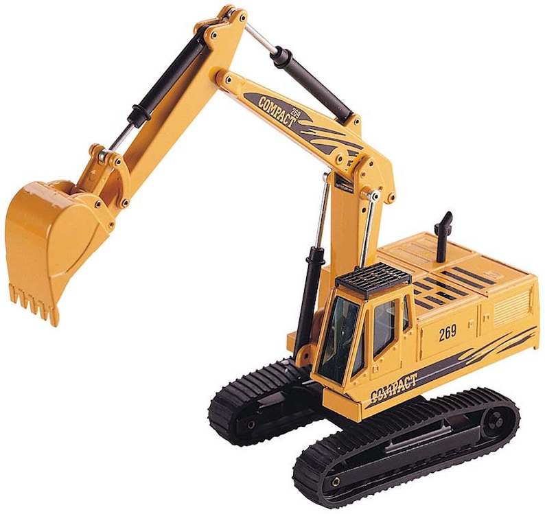 Puede incluir: Excavador de juguete amarillo con orugas negras y un brazo negro y amarillo. El excavador tiene una cabina negra con una ventana transparente y el texto "Compact 269" en el lateral.
