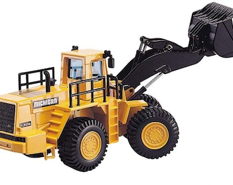 May include: A yellow toy construction vehicle with a black bucket, labeled "MICHIGAN L320".