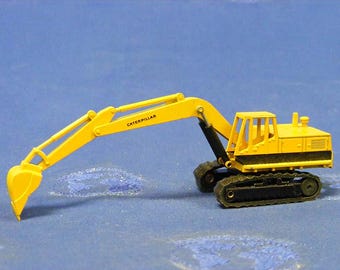 Excavadora de cadenas Caterpillar 225 en fundición a escala 1:87 en nuevos colores de NZG